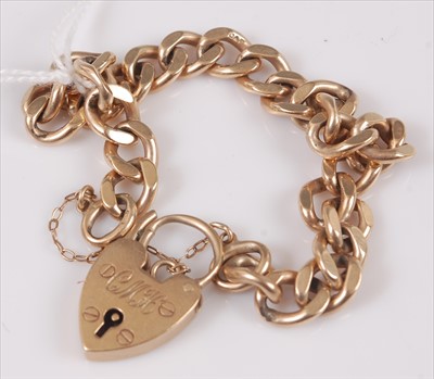 Lot 336 - A 9ct gold curblink bracelet with heart shaped...
