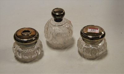 Lot 197 - A George V cut glass scent bottle, of globular...