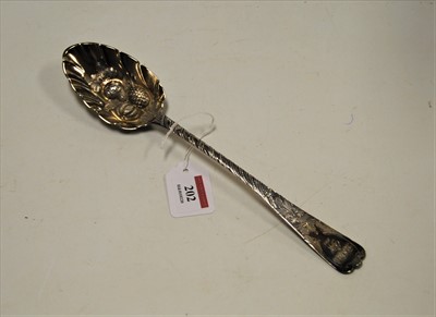Lot 202 - A George III silver berry spoon, the shaped...