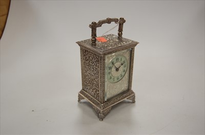 Lot 242 - A white metal cased carriage clock, having...