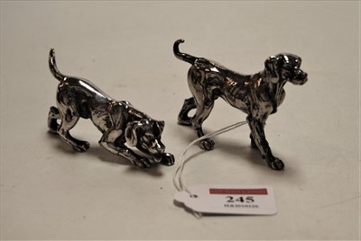 Lot 245 - A pair of white metal models of gun dogs,...
