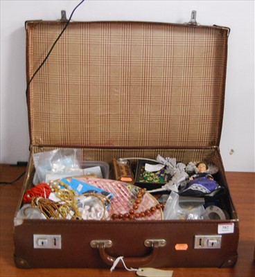 Lot 382 - A leather suitcase containing various items,...