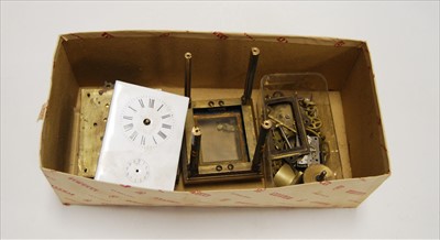 Lot 389 - A collection of clock parts, to include enamel...