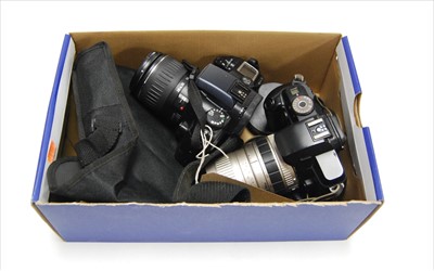 Lot 390 - A Canon EOS33 film camera; together with a...