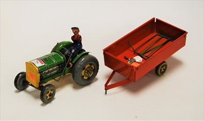 Lot 398 - A Mettoy tinplate tractor, with driver and...