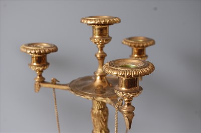 Lot 1289 - A pair of gilt brass four-light candelabra,...