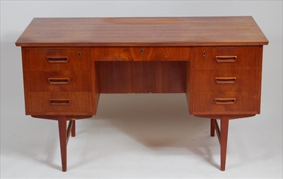 Lot 375 - A 1960s Danish teak kneehole writing desk,...