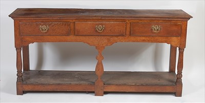 Lot 1497 - An 18th century joined elm and oak dresser...