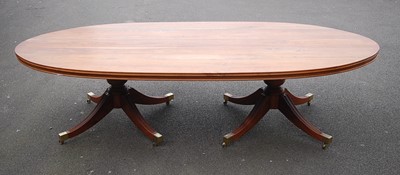 Lot 1512 - A Canadian walnut twin pedestal dining table,...