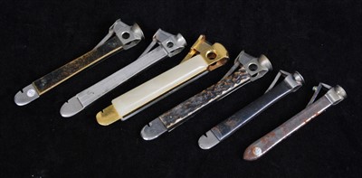 Lot 311 - A modern brass cigar cutter, having onyx...