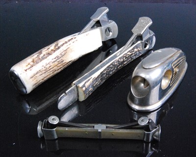 Lot 323 - A steel cigar cutter having stag antler grips...
