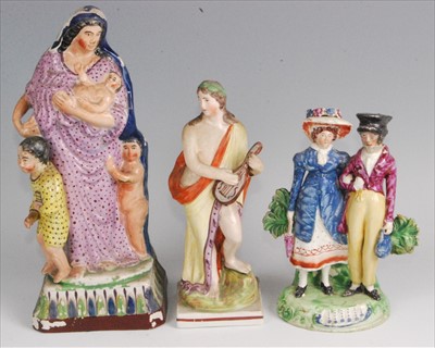 Lot 1116 - An early 19th century pearlware figure group...