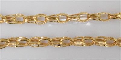 Lot 1231 - An 18ct yellow gold fancy triple oval textured...