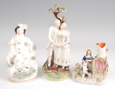 Lot 1129 - A Victorian Staffordshire bocage figure of an...
