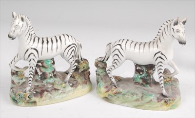 Lot 1132 - A pair of Victorian Staffordshire figures of...
