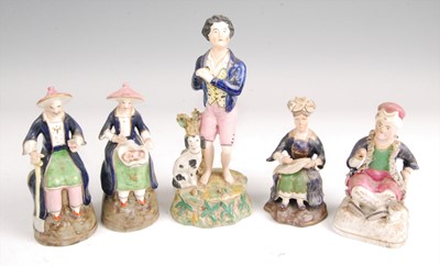 Lot 1134 - A pair of Victorian Staffordshire figures, the...