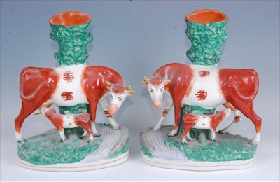 Lot 1106 - A pair of large Victorian Staffordshire spill...