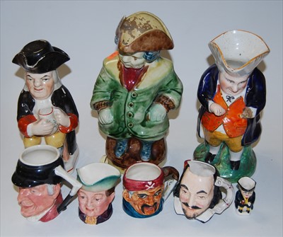 Lot 26 - A 19th century Staffordshire Toby jug, in...