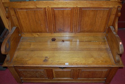 Lot 1090 - A circa 1900 oak three panelled fold-over...