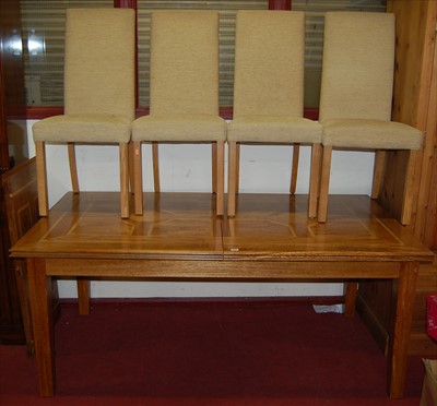 Lot 1118 - A contemporary hardwood extending dining table...