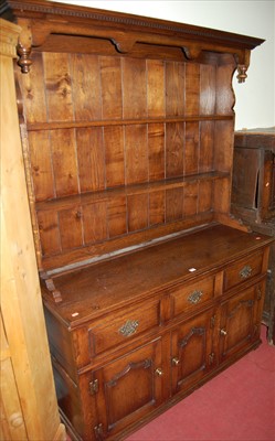 Lot 1134 - An 18th century style joined oak dresser,...