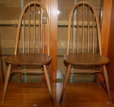 Lot 1139 - A pair of Ercol light elm stickback dining chairs