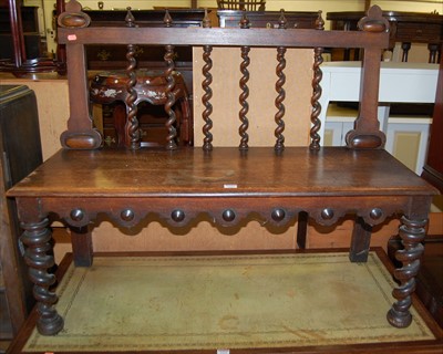 Lot 1153 - A late Victorian oak panelled seat hall bench,...