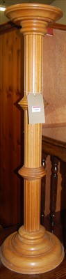 Lot 1161 - A contemporary beech fluted pedestal plant...