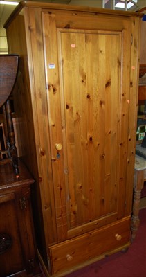 Lot 1164 - A modern pine Ducal single door wardrobe,...