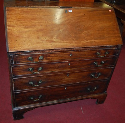 Lot 1168 - An early 19th century mahogany slopefront...