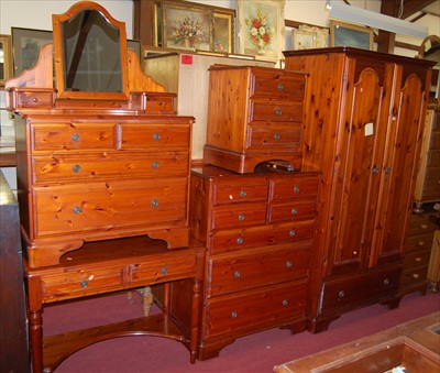 Lot 1169 - A modern stained pine Ducal bedroom suite,...