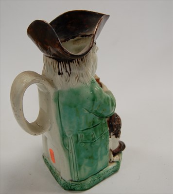 Lot 102 - A 19th century Staffordshire Toby jug, in...