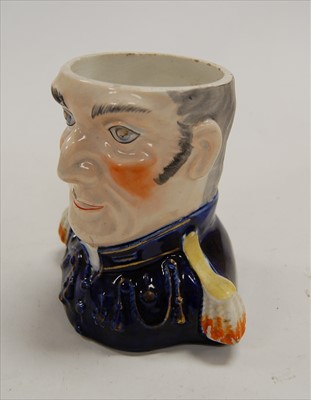 Lot 102 - A 19th century Staffordshire Toby jug, in...