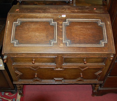 Lot 1184 - An early 20th century geometric moulded oak...