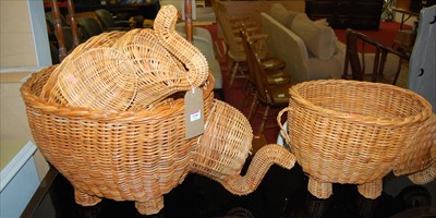 Lot 1190 - A pair of contemporary wicker elephant shaped...