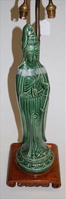Lot 110 - A large modern green glazed figural table lamp,...