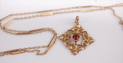 Lot 349 - A 9ct gold garnet set lozenge pendant;...