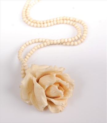 Lot 351 - A Victorian carved ivory 'rosebud' pendant, on...
