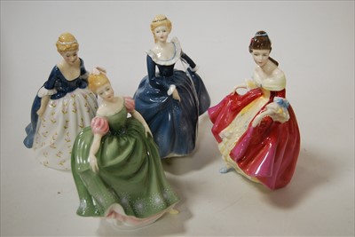 Lot 152 - Four Royal Doulton figurines, comprising...