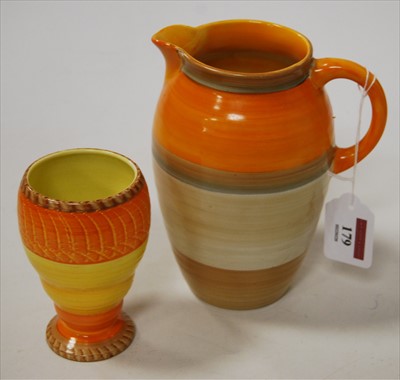 Lot 179 - A Shelley pottery jug, having orange banded...