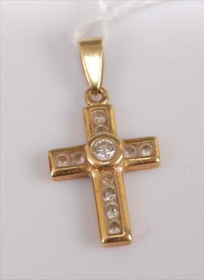 Lot 381 - An 18ct gold brilliant cut diamond set cross...