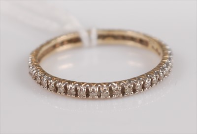 Lot 384 - A 9ct gold diamond point set eternity ring...