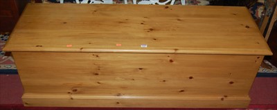 Lot 1245 - A modern pine long hinge topped blanket box, w....