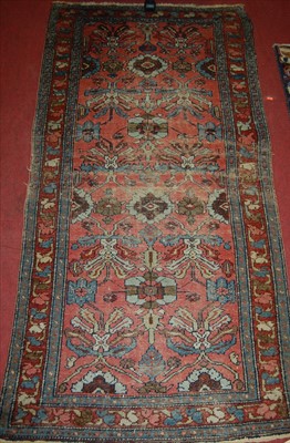 Lot 1282 - A Persian woollen hall runner, having a...