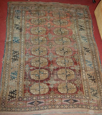 Lot 1283 - A Persian woollen Bokhara rug (heavily worn),...