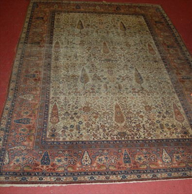 Lot 1285 - A Persian woollen pale ground rug, continously...