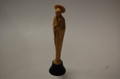 Lot 297 - A faux ivory figure of the Madonna and Child,...