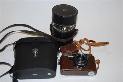 Lot 470 - A pair of modern Green Kat field binoculars;...