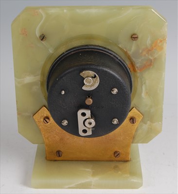 Lot 184 - An Art Deco onyx and gilt brass mantel clock,...