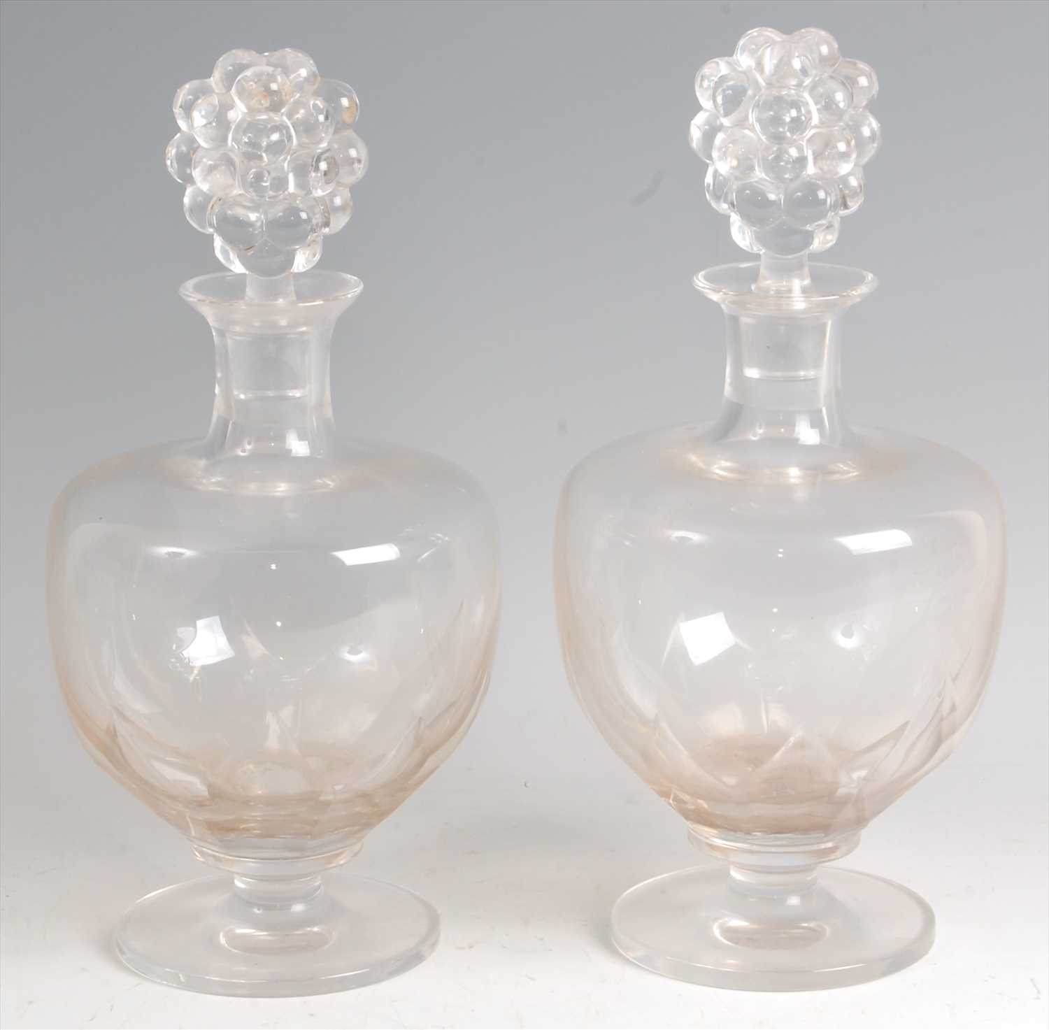 Lot 65 - A pair of 1920s Lalique crystal glass pedestal...